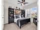 This is a spare bedroom with dark furniture, a ceiling fan, and windows at 447 Honeyhill Loop, Conway, SC 29526