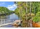 View of community boat dock on the Waccamaw River with mature trees at 447 Honeyhill Loop, Conway, SC 29526