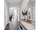 Elegant foyer with hardwood floors, arched doorway, and decorative mirror at 447 Honeyhill Loop, Conway, SC 29526