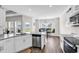 Well-equipped kitchen with stainless steel appliances, granite countertops, and modern finishes at 447 Honeyhill Loop, Conway, SC 29526