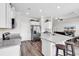 Bright kitchen featuring stainless steel appliances, granite countertops, and wood floors at 447 Honeyhill Loop, Conway, SC 29526