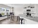 Modern kitchen with granite countertops, stainless steel appliances, and cozy breakfast nook at 447 Honeyhill Loop, Conway, SC 29526