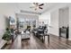 Bright living room with wood flooring, and an open view into the kitchen at 447 Honeyhill Loop, Conway, SC 29526