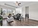 Spacious living room with tray ceilings, recessed lighting, and wood flooring at 447 Honeyhill Loop, Conway, SC 29526