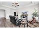 Comfortable living room featuring wood floors, ample seating, and a ceiling fan at 447 Honeyhill Loop, Conway, SC 29526