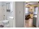 Bright bathroom featuring a shower-tub combination and a bedroom view at 4505 N Kings Hwy. # E2, Myrtle Beach, SC 29577