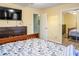 Comfortable bedroom boasts warm colors, wood floors, closet with mirrored doors and natural light at 4505 N Kings Hwy. # E2, Myrtle Beach, SC 29577