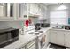 Bright kitchen featuring white appliances, plenty of counter space, and ample storage at 4505 N Kings Hwy. # E2, Myrtle Beach, SC 29577