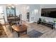 Cozy living room features a mirrored wall, wood flooring and a dining table for entertaining at 4505 N Kings Hwy. # E2, Myrtle Beach, SC 29577