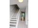 Bright staircase leading to the upper level, with a view into the living area at 4505 N Kings Hwy. # E2, Myrtle Beach, SC 29577