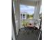 Charming balcony featuring outdoor seating and a view of the surrounding community and landscaping at 4753 Wild Iris Dr. # 301, Myrtle Beach, SC 29577