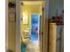 Open bathroom doorway revealing modern toilet and sink, complemented by bright, refreshing natural light at 4753 Wild Iris Dr. # 301, Myrtle Beach, SC 29577