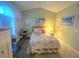 Cozy bedroom featuring a floral bedspread, complemented by soft, natural light and soothing wall decor at 4753 Wild Iris Dr. # 301, Myrtle Beach, SC 29577