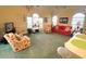 Bright living room with large windows, chandelier, and comfortable seating arrangement at 4753 Wild Iris Dr. # 301, Myrtle Beach, SC 29577