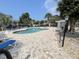 Community swimming pool featuring comfortable lounging chairs and shaded areas for relaxation and enjoyment at 4753 Wild Iris Dr. # 301, Myrtle Beach, SC 29577
