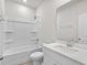 Clean and well-lit bathroom with a shower/tub combo and a vanity at 4846 Hopespring St., Myrtle Beach, SC 29579
