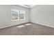 Cozy bedroom with plush carpeting and natural light from a double window at 4846 Hopespring St., Myrtle Beach, SC 29579