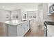 Kitchen showcases a white island, stainless steel appliances, and open-concept design at 4846 Hopespring St., Myrtle Beach, SC 29579
