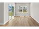 Bright living room with sliding glass doors and wood-look flooring at 4846 Hopespring St., Myrtle Beach, SC 29579