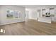 Bright living space featuring a kitchen with an island and wood-look flooring at 4846 Hopespring St., Myrtle Beach, SC 29579