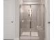Modern shower features a glass door, built-in shelves, and sleek tile work at 4877 Hopespring St., Myrtle Beach, SC 29579