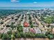 Aerial view of a coastal community featuring beautiful homes, lush greenery, a lake, and the ocean in the distance at 504 Sea Vista Ln., North Myrtle Beach, SC 29582