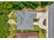 Aerial view of a home showcasing the roof, backyard patio, landscaping, and circular driveway at 504 Sea Vista Ln., North Myrtle Beach, SC 29582