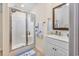 Bathroom featuring tile flooring, a glass enclosed shower, vanity, and framed mirror at 504 Sea Vista Ln., North Myrtle Beach, SC 29582