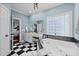 Elegant bathroom with a soaking tub, black and white tile, and a vanity area at 504 Sea Vista Ln., North Myrtle Beach, SC 29582