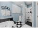 Modern bathroom with a glass-enclosed shower and a separate soaking tub at 504 Sea Vista Ln., North Myrtle Beach, SC 29582