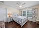 Bedroom featuring hardwood flooring, white shutters, a ceiling fan, and a queen sized bed at 504 Sea Vista Ln., North Myrtle Beach, SC 29582