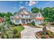 Stunning two-story home with manicured landscaping, a circular driveway, and a welcoming front porch at 504 Sea Vista Ln., North Myrtle Beach, SC 29582