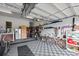 Spacious garage with organized storage solutions, exercise equipment, and durable flooring at 504 Sea Vista Ln., North Myrtle Beach, SC 29582