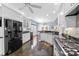 Spacious kitchen with black appliances, white cabinets, and a kitchen island at 504 Sea Vista Ln., North Myrtle Beach, SC 29582