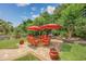 Lovely patio with outdoor dining set, grill, stone wall, and lush greenery, perfect for entertaining at 504 Sea Vista Ln., North Myrtle Beach, SC 29582