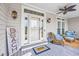 Inviting front porch with cozy seating, stylish lighting, and a decorative 'Beach' sign at 504 Sea Vista Ln., North Myrtle Beach, SC 29582
