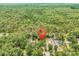 Aerial view of wooded acreage with red location pin over homesites at 5114 Cowart Ct., Murrells Inlet, SC 29576
