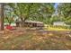 Large backyard with various landscaping features and mature trees at 5114 Cowart Ct., Murrells Inlet, SC 29576
