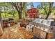 Spacious backyard featuring a large stainless steel grill and outdoor cooking area at 5114 Cowart Ct., Murrells Inlet, SC 29576