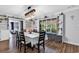 Bright dining room featuring hardwood floors, modern light fixture, and decorative window bench at 5114 Cowart Ct., Murrells Inlet, SC 29576