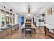 Dining room featuring hardwood floors, stylish light fixture, a fireplace, and a window bench at 5114 Cowart Ct., Murrells Inlet, SC 29576