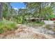 View of a charming home with abundant green trees and landscaped grounds at 5114 Cowart Ct., Murrells Inlet, SC 29576