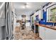 Bright kitchen with stainless steel refrigerator, wooden countertops and island with seating at 5114 Cowart Ct., Murrells Inlet, SC 29576