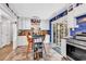 Open kitchen featuring center island with seating and adjacent sliding doors to the patio at 5114 Cowart Ct., Murrells Inlet, SC 29576