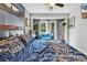 Cozy bedroom featuring an outdoor seating area visible through sliding glass doors at 5114 Cowart Ct., Murrells Inlet, SC 29576