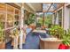 Comfortable sunroom with wicker furniture, lots of potted plants, and a translucent ceiling for natural light at 5114 Cowart Ct., Murrells Inlet, SC 29576