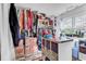 Spacious walk-in closet with custom shelving and storage, plus natural light from windows at 5114 Cowart Ct., Murrells Inlet, SC 29576