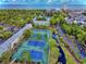 Beautiful aerial view of the community with the ocean in the distance, manicured grounds, and tennis courts at 5905 S Kings Hwy. # 206A, Myrtle Beach, SC 29575