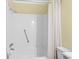 This bathroom features a full tub, shower with neutral walls, and a white shower curtain at 5905 S Kings Hwy. # 206A, Myrtle Beach, SC 29575