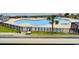 An inviting, large community pool surrounded by sun loungers, perfect for relaxation and summer fun at 5905 S Kings Hwy. # 206A, Myrtle Beach, SC 29575